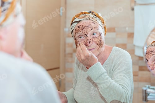 Preview: Senior woman taking care of her face