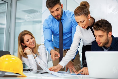 Preview: Young team of business people work together on a project