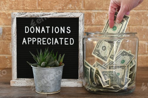Preview: Donations Sign with Full Jar of Money