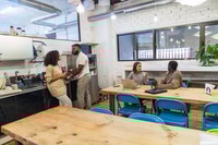 Preview: Young professionals enjoying coffee break in coworking space