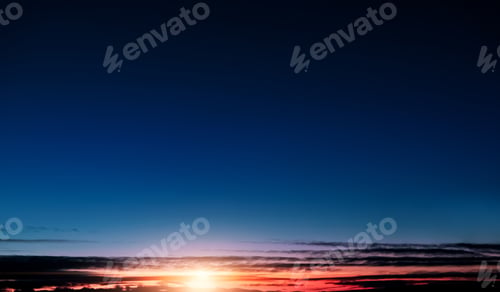 Preview: Sky Sunset in Winter,Sunrise background with gradient blue,orange,yellow,pink sunlight and cloud