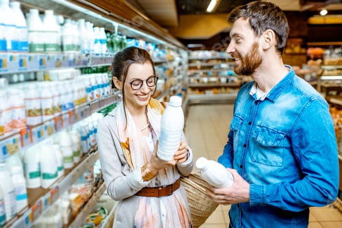 Preview: Couple buying dairy products in the supermarket
