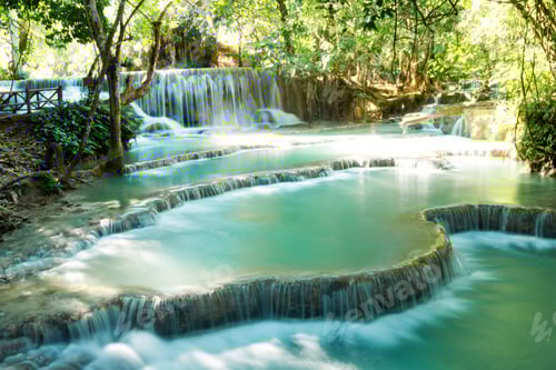 Preview: Scenic view on Kuang Si waterfall with turquoise water on a sunny day. Luangprabang, Laos.