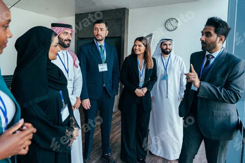 Preview: Multiethnic business people having corporate meeting in dubai office