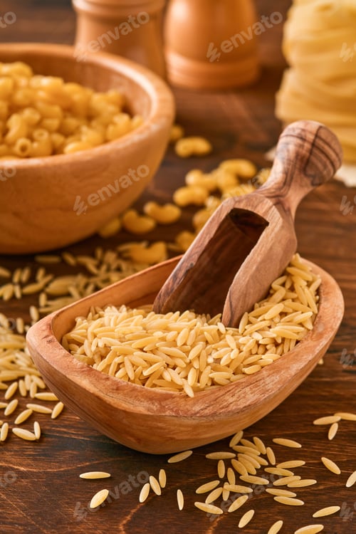 Preview: Ptititm or israeli couscous - kind of small pasta, traditional for israelian cuisine on an old woode