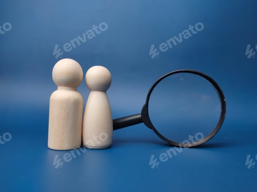 Preview: Wooden peg doll and magnifying glass on a blue background.