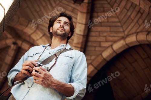Preview: Go out and see the world. Shot of a handsome young tourist checking out the sights.