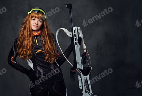 Preview: Studio portrait of a redhead female Biathlon champion.