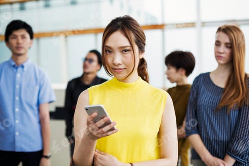 Preview: Small group of people standing on the platform of a subway station, Tokyo commuters.