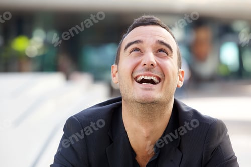 Preview: Close up happy man laughing and looking up