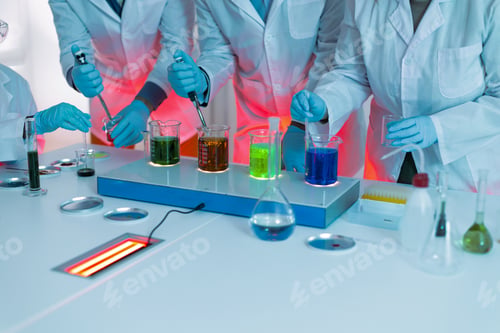 Preview: Scientists team conducting chemistry experiment in laboratory