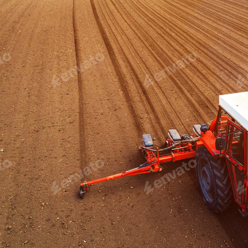 Preview: Aerial view of tractor with mounted seeder performing direct see