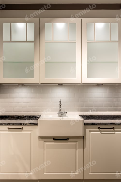 Preview: Kitchen sink and cabinets with lighting in modern interior. Bright minimalist kitchen design.
