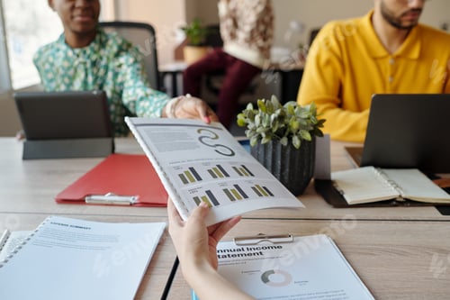 Preview: Handing Financial Report to Young Adult Coworkers in Creative Coworking Space