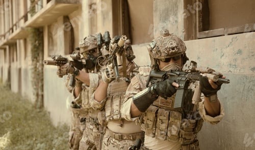 Preview: Professional marine soldiers training with weapon on a military range.