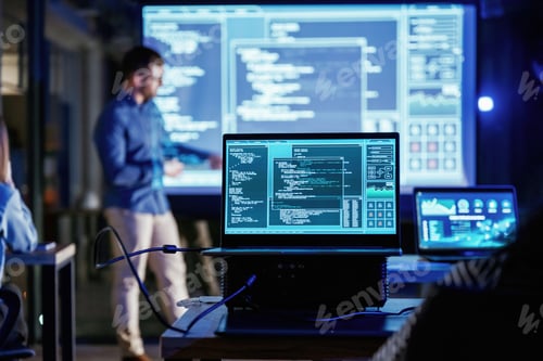 Preview: Male business trainer is against projector with data, teaching people