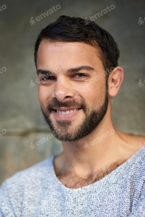 Preview: Handsome is the man who is happy. Shot of a handsome young man posing outdoors.