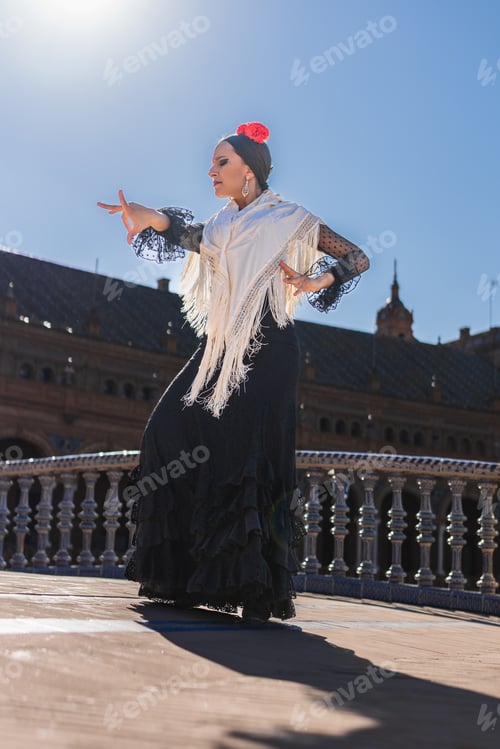 Preview: Flamenco dancer illuminated by the sun while dancing outdoors