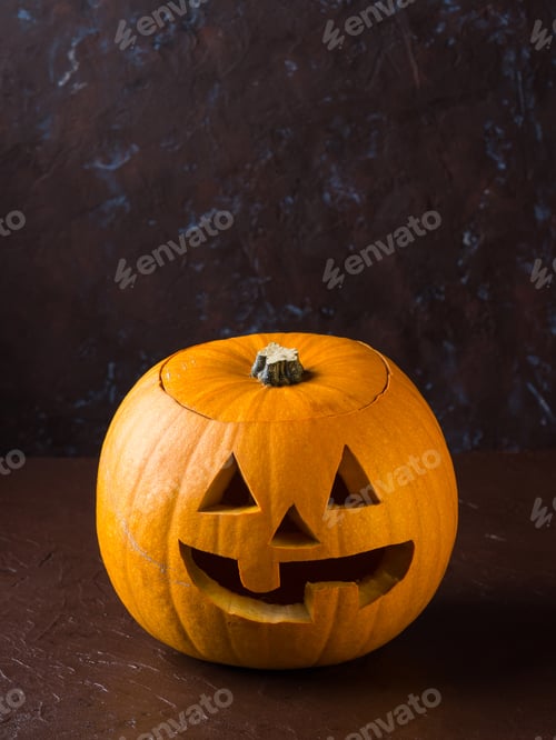 Preview: Halloween carved squash on dark background