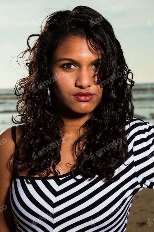 Preview: Pretty Indian Girl With Long Hair On The Beach In Summer.