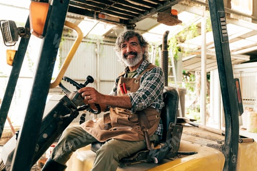 Preview: Farmer senior man working in his farm and greenhouse