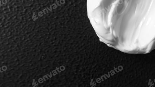 Preview: Smear moisturizer for face. Cream for body on black background with copy space for banner