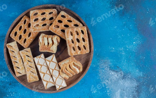 Preview: cookies on the wooden tray ,on the blue background