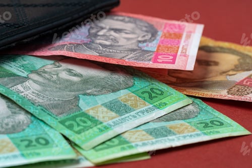 Preview: Ukrainian money hryvnia close up on carton background
