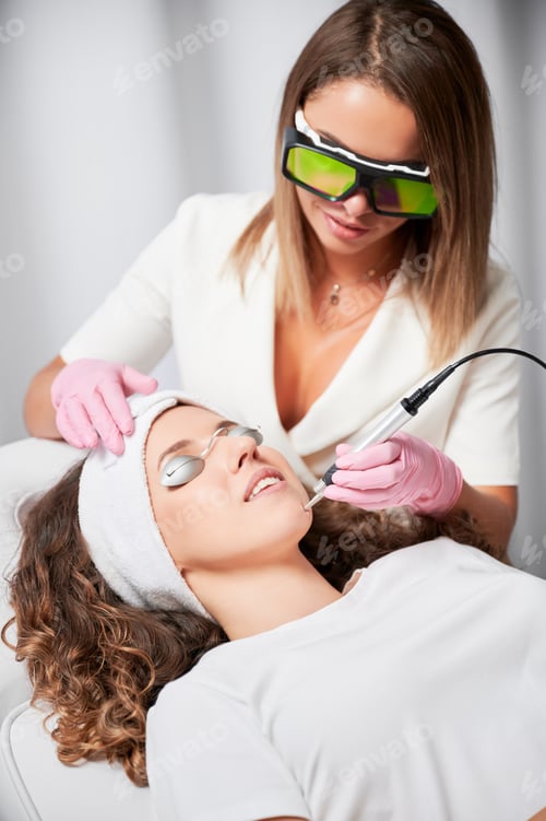 Preview: Treatment of telangiectasias with latest laser energy in beauty salon.