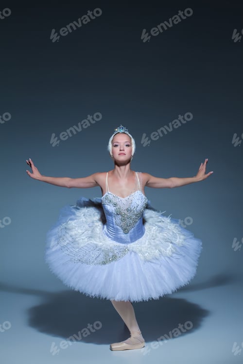 Preview: Portrait of the ballerina in ballet tatu on blue background