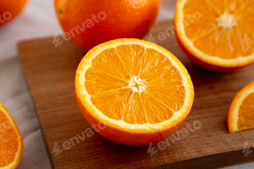 Preview: Raw Organic Sweet Oranges on a wooden board, low angle view. Close-up.
