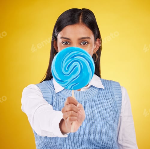 Preview: Hide, lollipop and candy with portrait of woman in studio for sweets, snack and food. Treats, desse