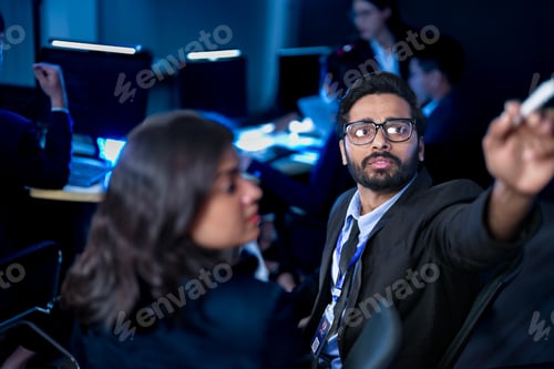 Preview: software developers smile with satisfaction during a pair programming session