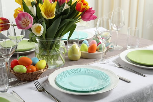 Preview: Easter celebration. Festive table setting with beautiful flowers and painted eggs