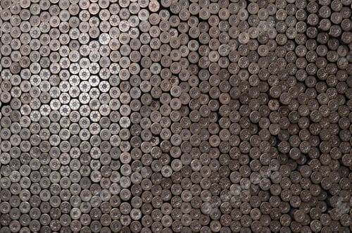 Preview: Pattern of 12 gauge cartridges for shotgun bullets. Shells for hunting rifle close up