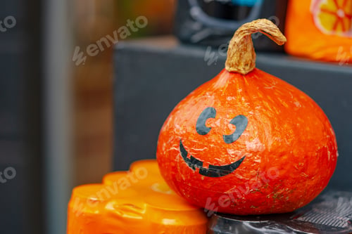 Preview: Halloween pumpkin in a market on a fruit shelf