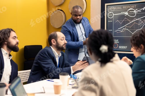 Preview: Team of company employees discussing agenda for upcoming projects