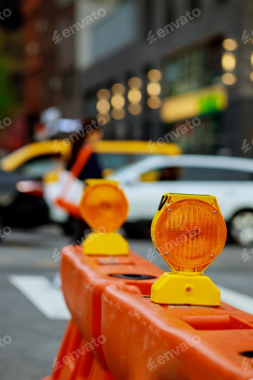 Preview: Roadblock or construction with signal on a road red and white street barricade.