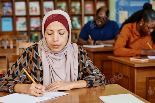 Preview: Woman Writing In Notebook