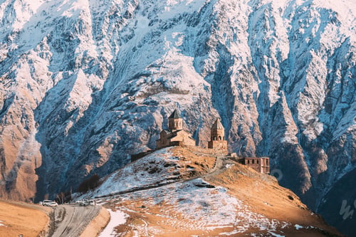 Preview: Stepantsminda, Gergeti, Georgia. Iconic Famous Gergeti Trinity Tsminda Sameba Church In Early Winter