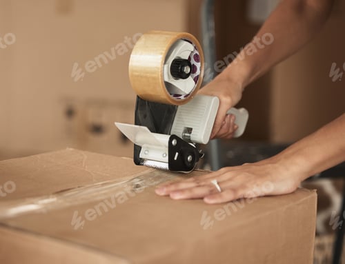 Preview: Shot of a unrecognizable woman packing up to move in a room at home