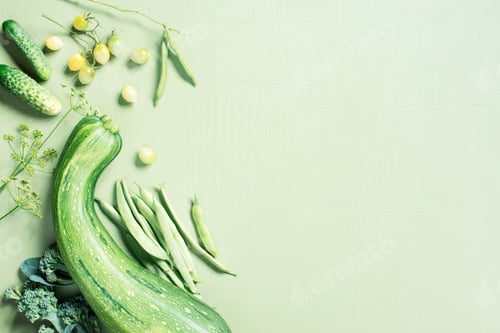 Preview: Healthy food concept, background with fresh vegetables on the green table