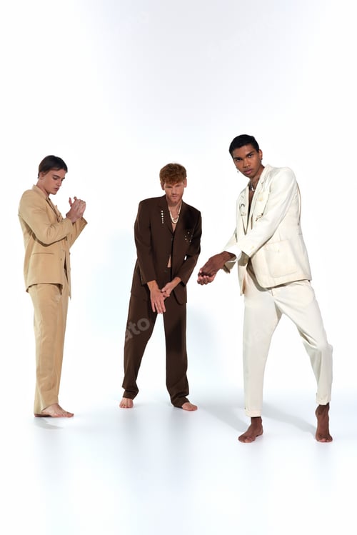 Preview: good looking multicultural male models posing actively in unbuttoned classy suits, men power