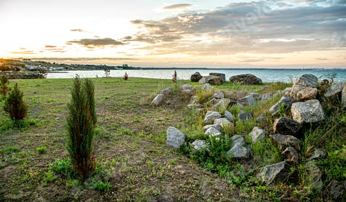 Preview: Beautiful landscape by the sea at sunset.