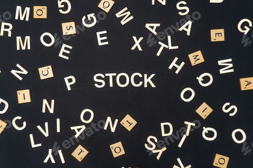 Preview: STOCK word written on dark paper background. STOCK text for your concepts