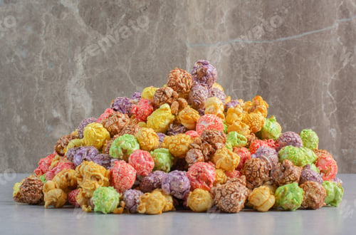 Preview: Colorful popcorn candy piled on marble background