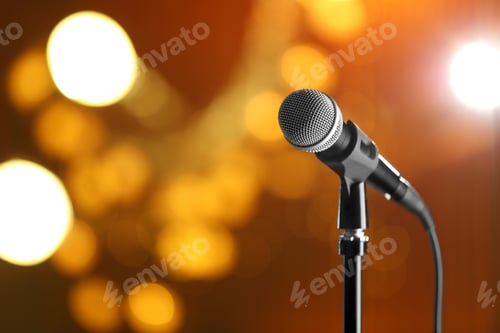 Preview: Microphone against festive lights, space for text