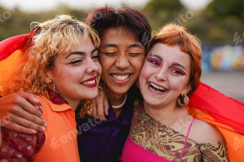 Preview: Happy multiracial people having fun together in front of camera during gay pride parade