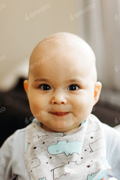 Preview: Sweet smiling baby with big eyes and chubby cheeks