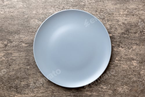 Preview: Top view of empty grey plate on cement background. Empty space for your design
